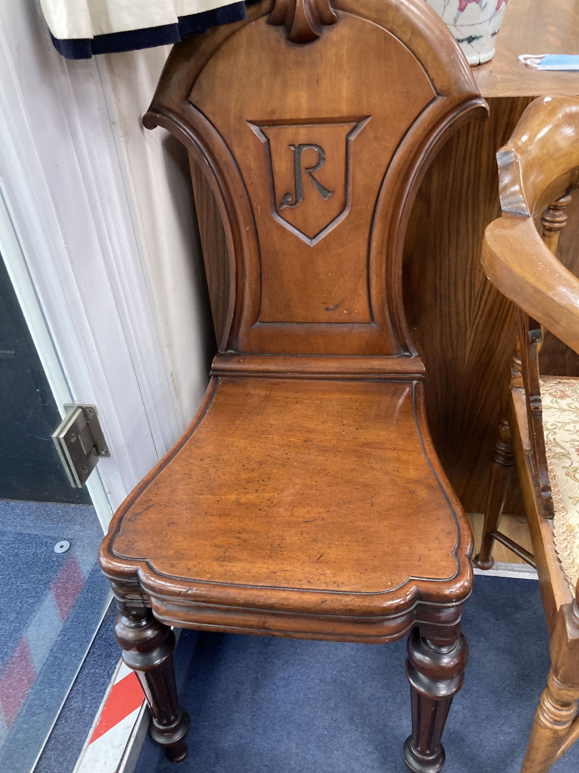 A Victorian mahogany hall chair and an Edwardian mahogany corner elbow chair